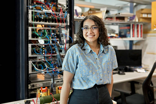 Woman engineer handling electrical work in office