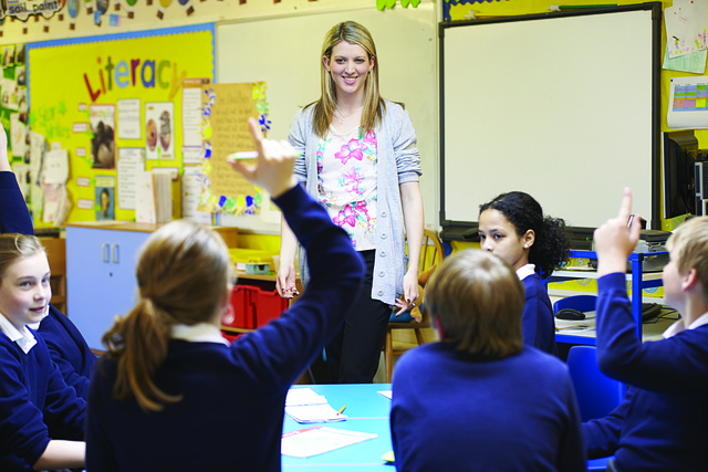 The teacher asks the student the reason for coming late