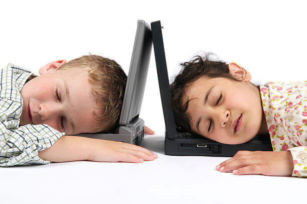 The children were so tired of using the computer that they fell asleep there