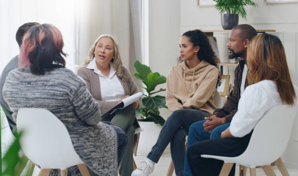 A woman officer interviewing candidates for counsellor training