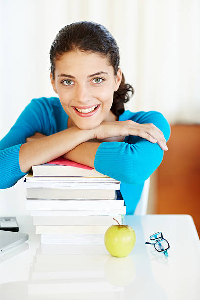 Female student overwhelmed with joy after reading enlightening books