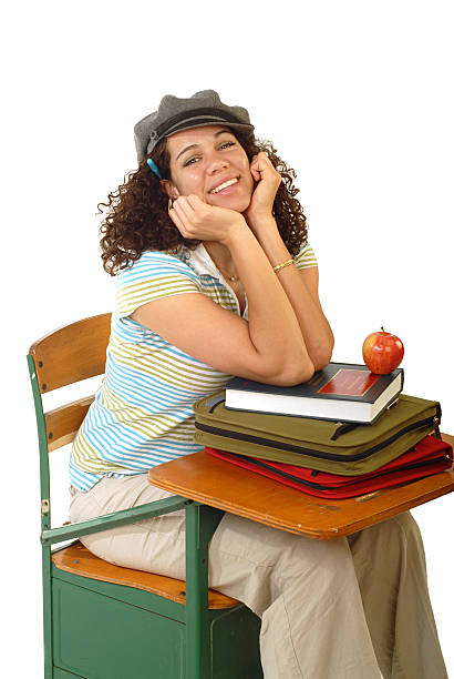 Female student on her way to college with books and bags