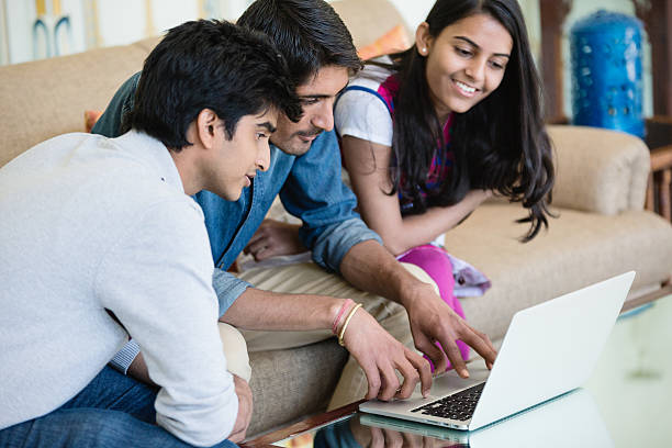 Male and female students searching and discussing content on the internet