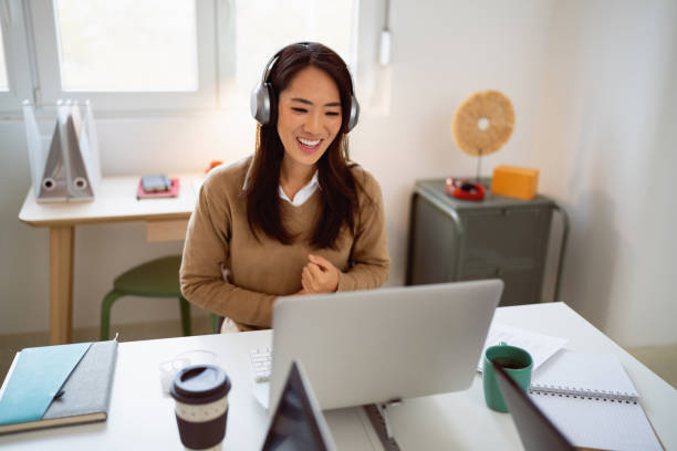 A professional woman searching for her work content through a laptop on the internet