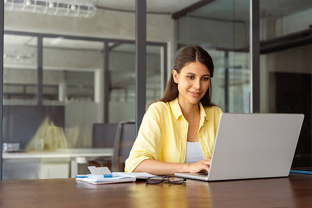 Female student searching for her study material on laptop
