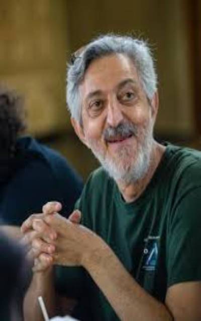 Mathematician Avi Wigderson sitting with his colleagues at the Institute
