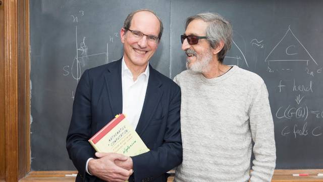 Mathematician Avi Wigderson stands with Herbert H Maas