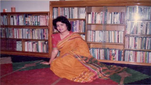 Taslima Nasreen sitting in her library and inspecting