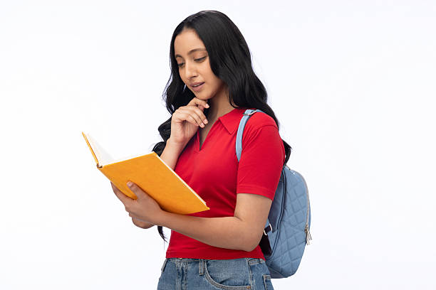 Female student pretending to read notes while standing