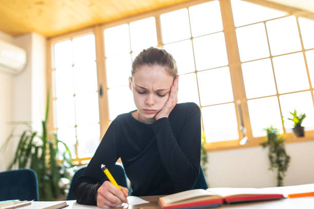 Female student solving maths questions in math study room