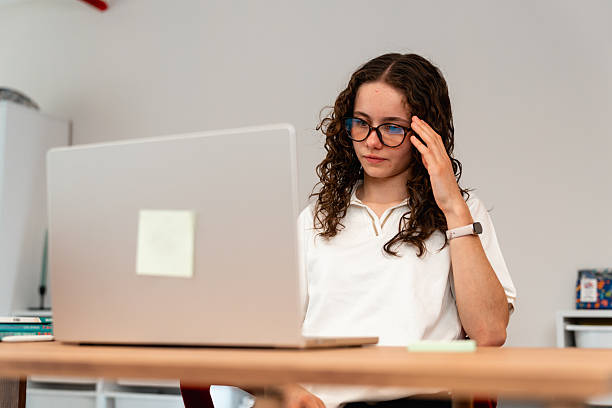 Girl student is upset over not being able to understand mathematics even from laptop
