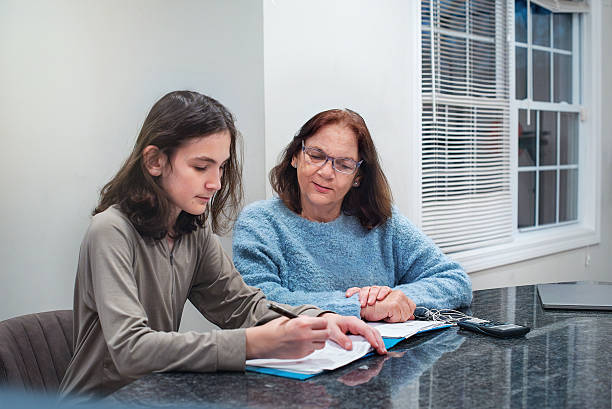 Tutor making Girl college student solve math problems