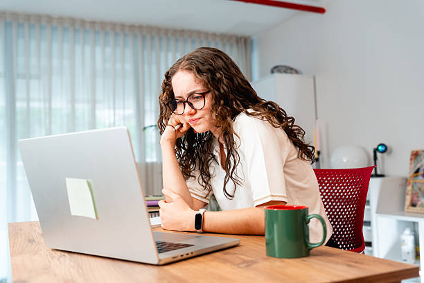 Female student understands math questions with laptop