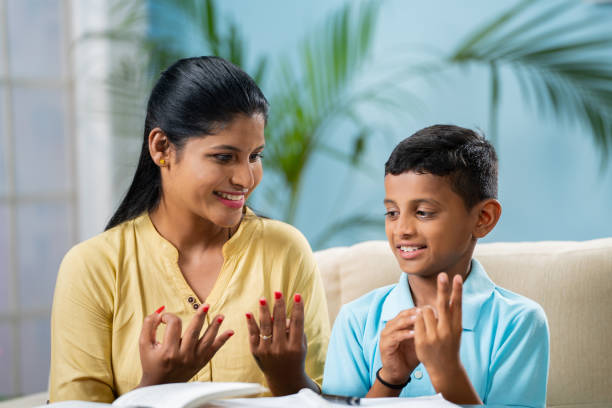 Sister and brother sitting together studying mathematics