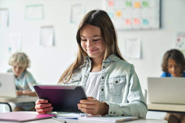 Female student studying math exercises from a tablet