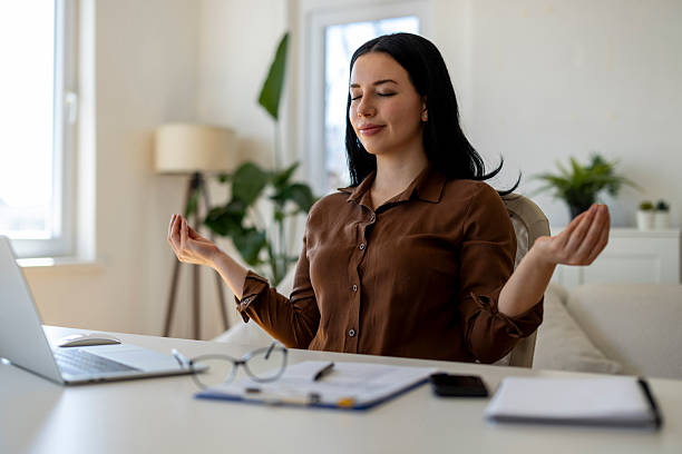 College female student meditates sitting on a stool to train her brain