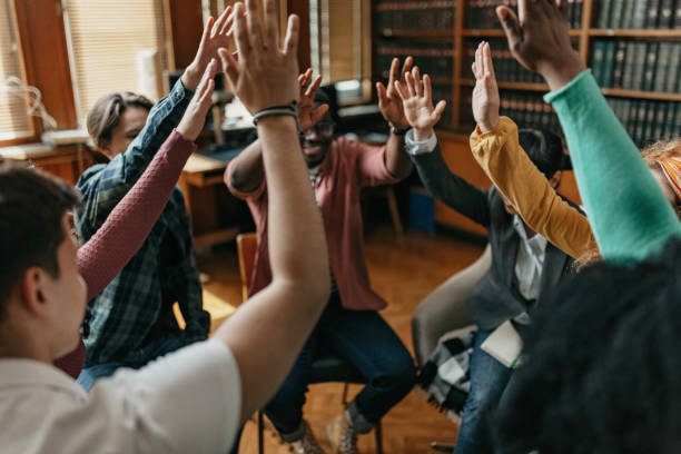Student dancing in the classroom pretending to remembrance