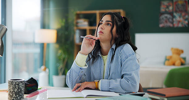 Female student trying to remember while reading