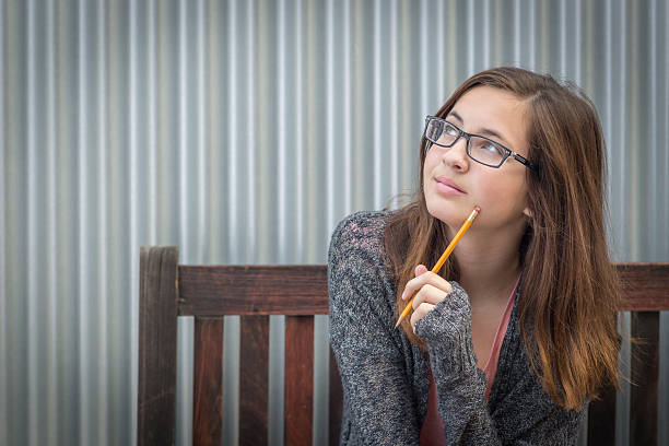 Female student trying to remember after reading