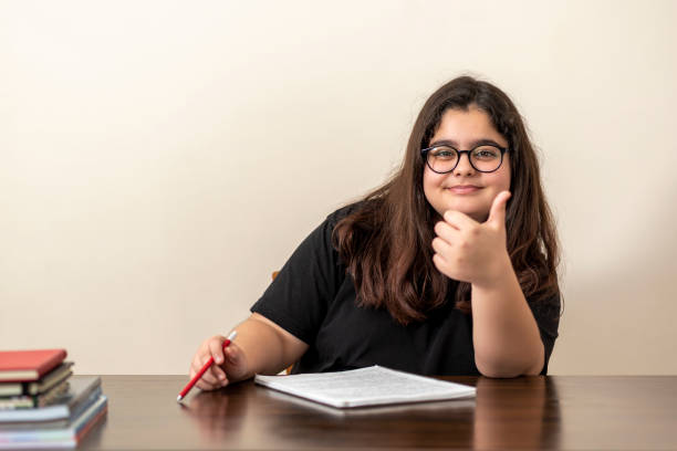 Female student expressing happiness at remembering what she had read