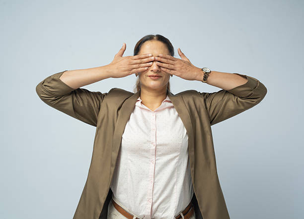 Female student tries to get rid of self-pity by massaging her eyes