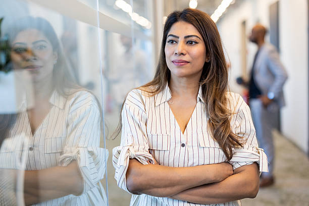 A girl stands alone and thinks of a way to keep up with corporate culture