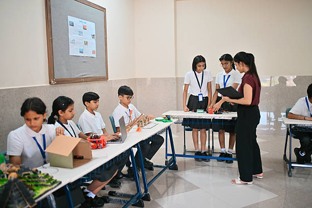 In the class,the teacher teaches the students through science practicals
