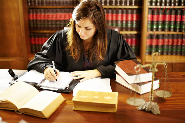 The female attorney drafts judicial petition for civil rights in her office