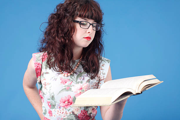 The girl student is studying the book with all her heart
