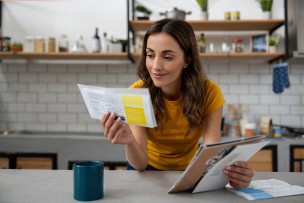 Female journalist looking at newsletters on laptop