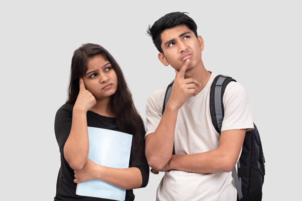 Depressed girl student and student are thinking about the underdevelopment of qualities