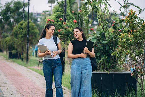 Two girl students are happily returning from college as they develop intrinsic qualities