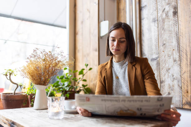 Girl reading in the newspaper about the examination