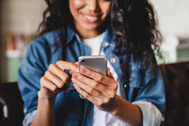 Female student surfing social platforms with mobile