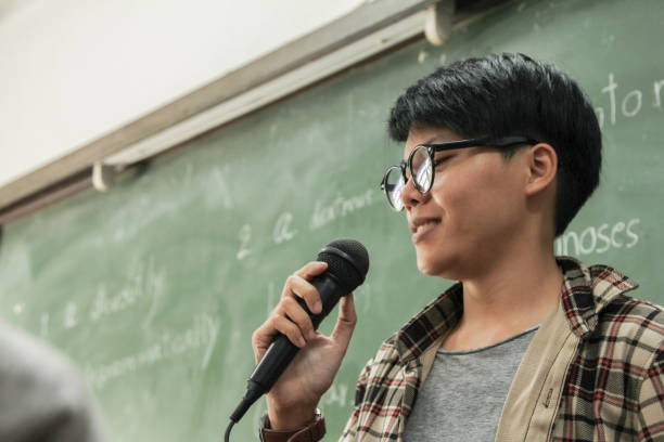 Student talking to the mic in class