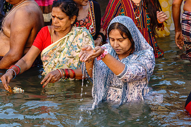 Women standing in the Ganges and offering water is also a form of Righteousness