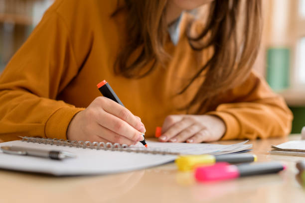 Girl student makes self-notes based on memory for competitive exam
