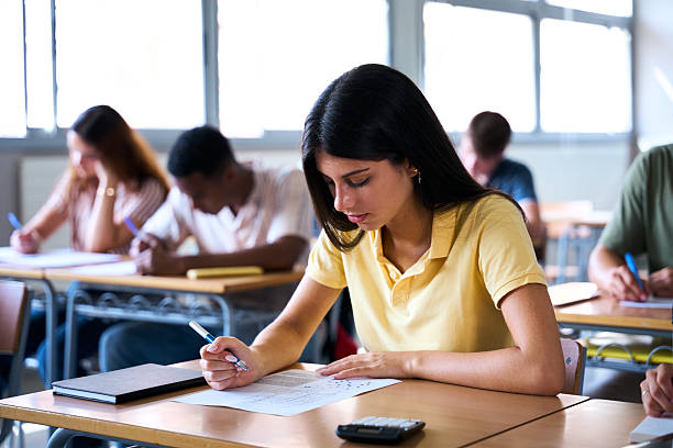Candidates taking the competitive exam exam in the examination hall