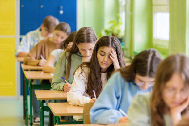 Students studying for competitive exam preparation in coaching