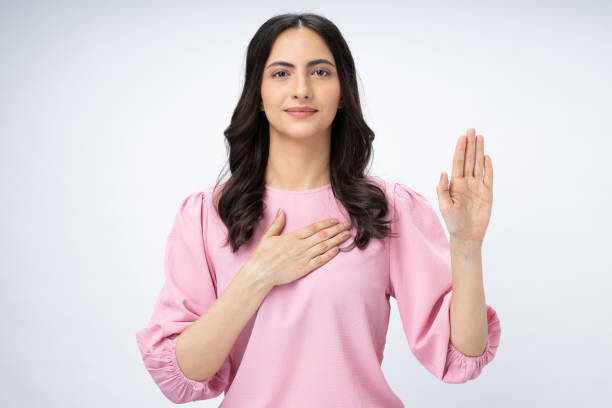 College Female Student Takes Pledge to Follow Moral Rules With Hands on Her Heart