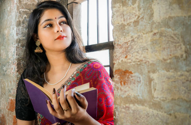 Woman reading and reflecting on the moral rules in the book