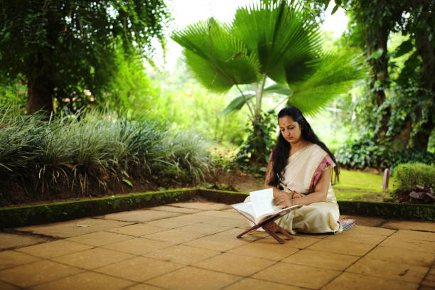 Hindu women reading Hindu religious texts in the lap of nature