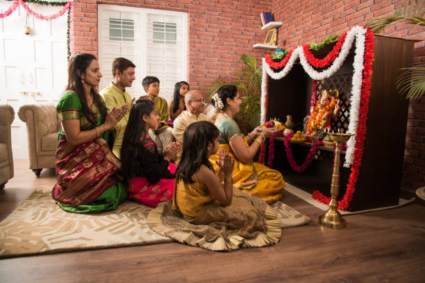 All members of a Hindu family praying