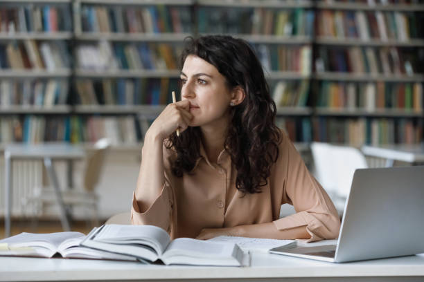 Girl Student Creating a Theme in Her Mind for Essay Writing