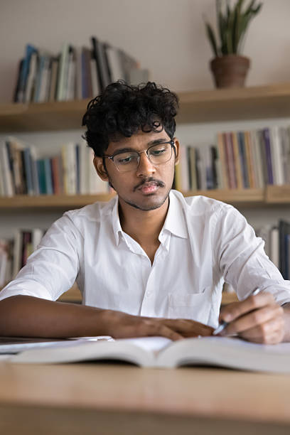 Student preparing for essay writing from laptop