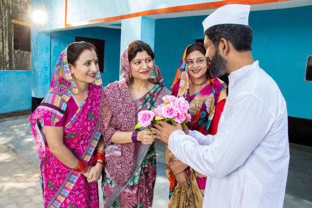Women pay floral tributes to the political leader