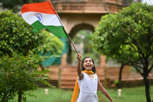 A little girl carrying the country's flag in a patriotic demonstration