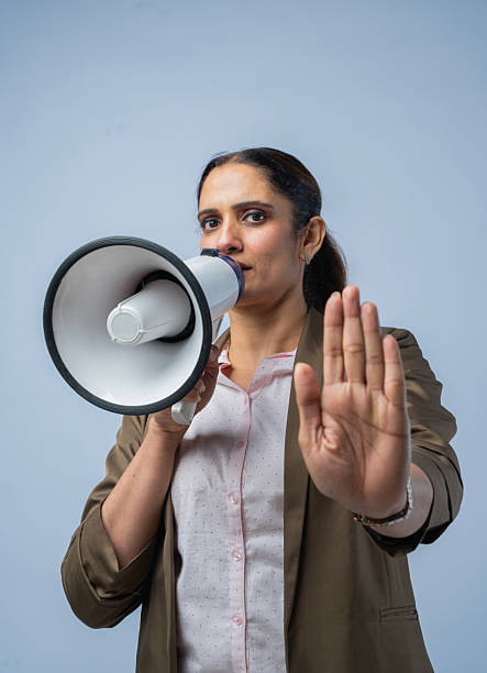 Woman speaks to the mic to demand human rights