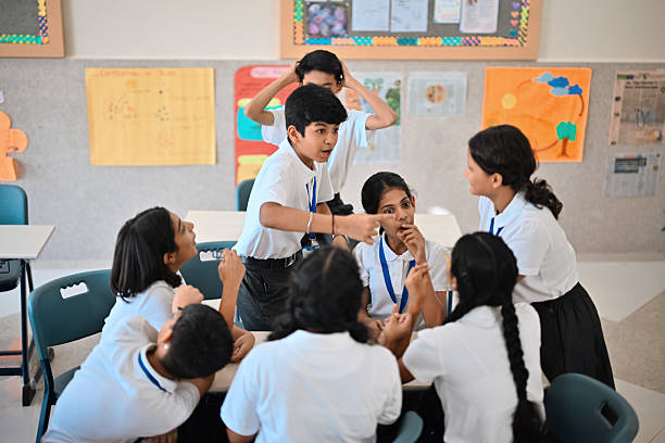Children in school discussing character traits