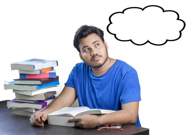 Student sits on a stool in the study room and prepares for the exam